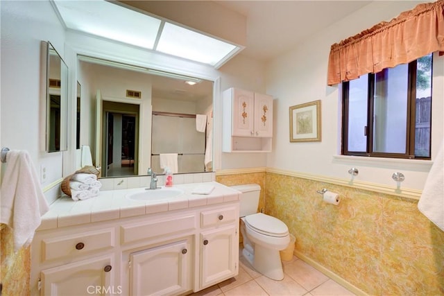 4185 Vanguard Dr, Lompoc, CA 93436 - bathroom featuring a wainscoted wall, vanity, and tile patterned flooring