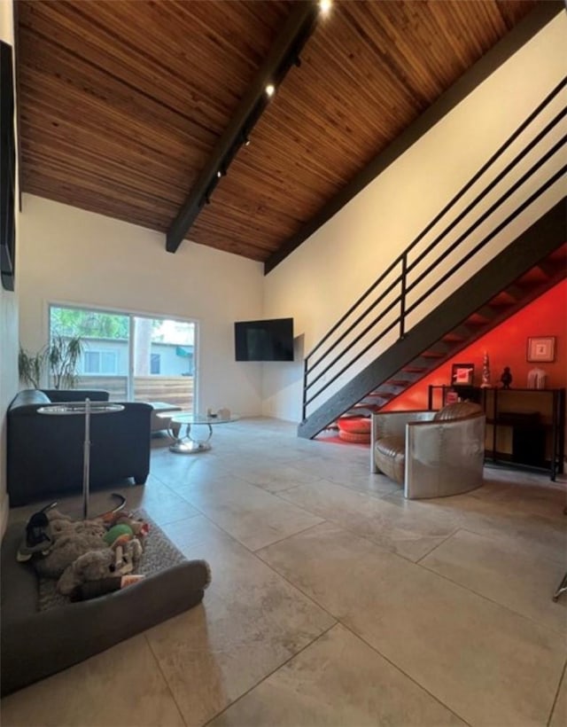 5460 White Oak Ave Unit A305, Encino, CA 91316 - living area featuring wood ceiling with exposed beams, rail lighting, stairway, and high vaulted ceiling