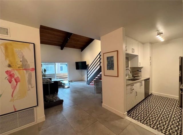 5460 White Oak Ave Unit A305, Encino, CA 91316 - hall featuring a sink, stairs, wood ceiling, baseboards, and dark tile patterned floors