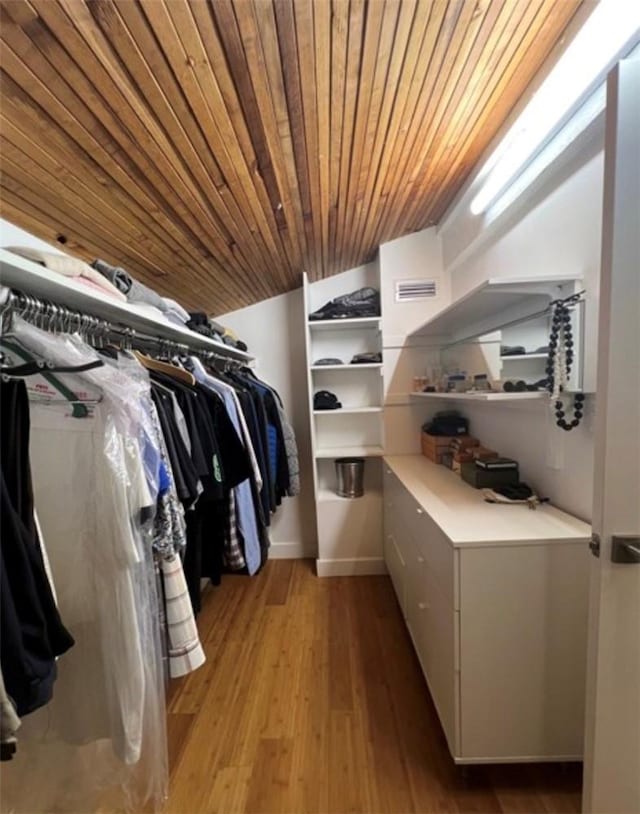 5460 White Oak Ave Unit A305, Encino, CA 91316 - walk in closet with light wood finished floors and lofted ceiling