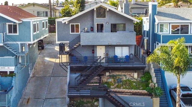 34051 Silver Lantern St, Dana Point, CA 92629 - back of house featuring stairs and stucco siding