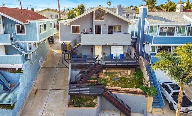 34051 Silver Lantern St, Dana Point, CA 92629 - view of front of house featuring stairway, stucco siding, and central AC