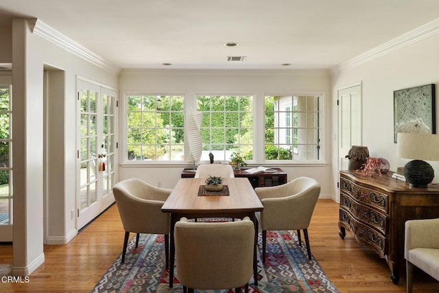 394 S Bonnie Ave, Pasadena, CA 91106 - dining space featuring healthy amount of natural light, light wood finished floors, crown molding, and baseboards