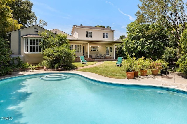 394 S Bonnie Ave, Pasadena, CA 91106 - rear view of house with stucco siding, a patio, an outdoor pool, and a yard