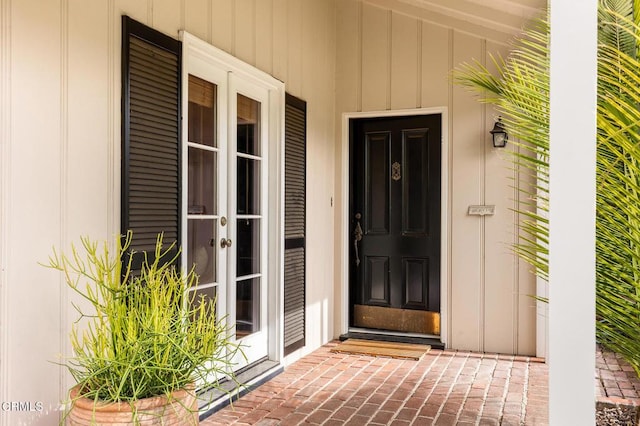394 S Bonnie Ave, Pasadena, CA 91106 - view of exterior entry featuring french doors, board and batten siding, and a porch