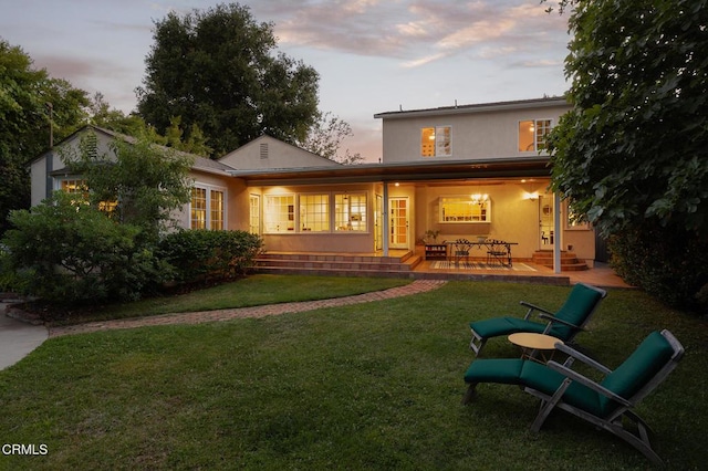 394 S Bonnie Ave, Pasadena, CA 91106 - back of house with stucco siding, a yard, and a porch