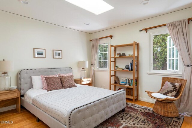 394 S Bonnie Ave, Pasadena, CA 91106 - bedroom featuring multiple windows and wood finished floors