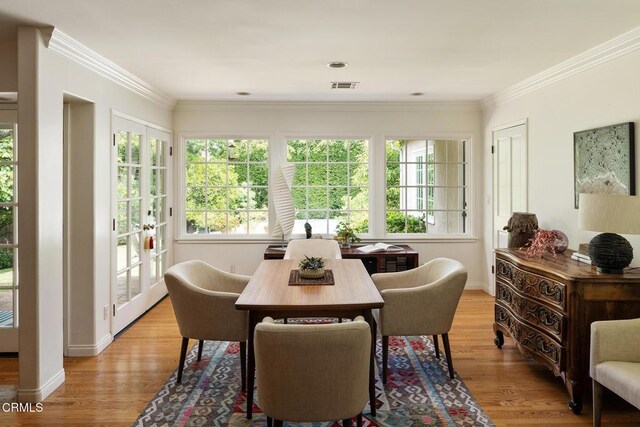 394 S Bonnie Ave, Pasadena, CA 91106 - dining area featuring healthy amount of natural light, light wood-style flooring, and ornamental molding