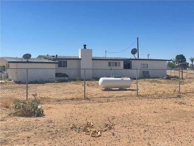 11252 Cactus Rd, Adelanto, CA 92301 - back of house featuring a chimney