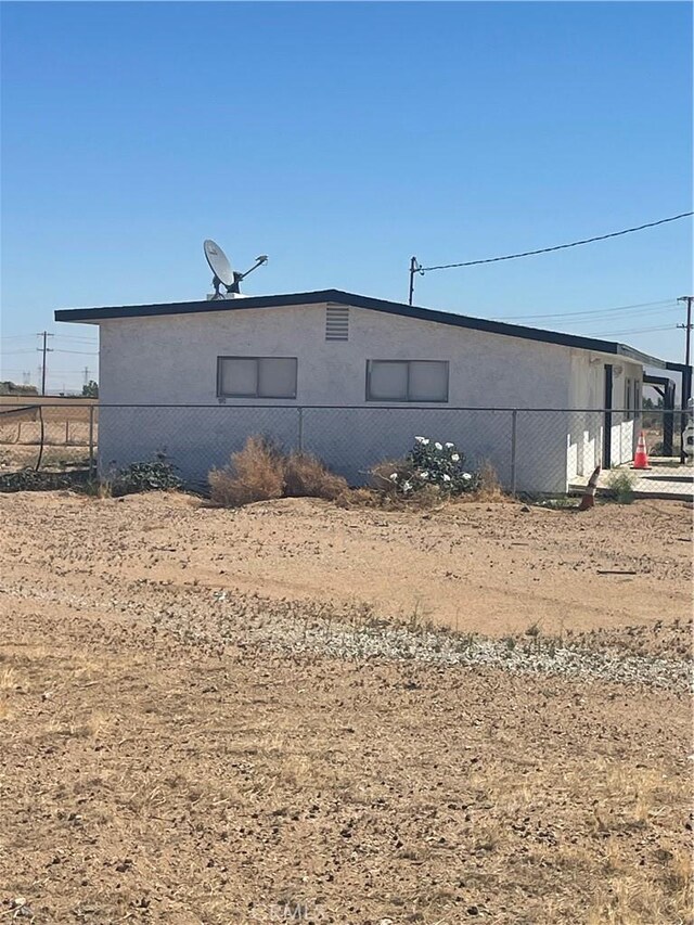11252 Cactus Rd, Adelanto, CA 92301 - back of property featuring stucco siding