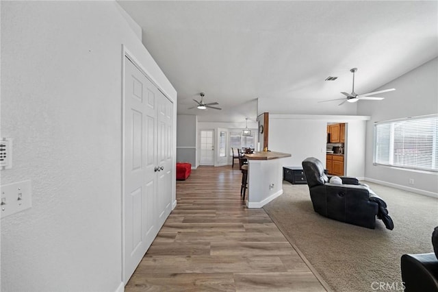 27175 Via Debra, Menifee, CA 92586 - corridor with baseboards, light wood-style floors, and lofted ceiling