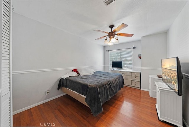 27175 Via Debra, Menifee, CA 92586 - bedroom with wood finished floors, baseboards, and a ceiling fan
