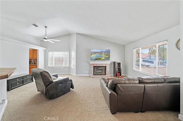 27175 Via Debra, Menifee, CA 92586 - living room with vaulted ceiling, a ceiling fan, a fireplace, light colored carpet, and baseboards