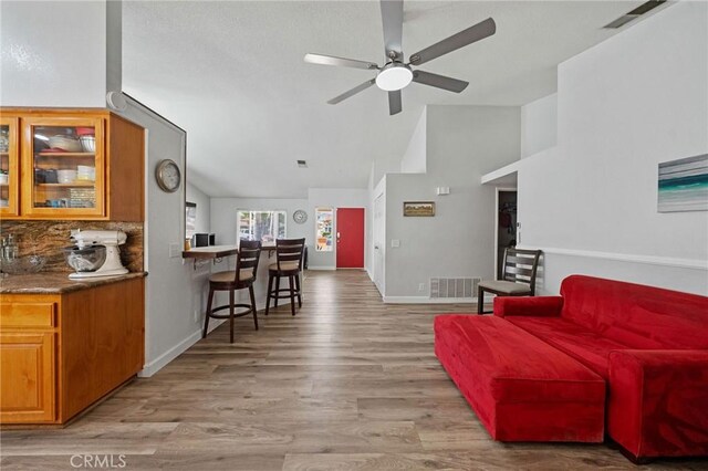 27175 Via Debra, Menifee, CA 92586 - living area with a ceiling fan, light wood finished floors, baseboards, and high vaulted ceiling