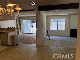 9025 Willis Ave Unit 141, Panorama City, CA 91402 - kitchen featuring healthy amount of natural light, carpet flooring, and dishwasher