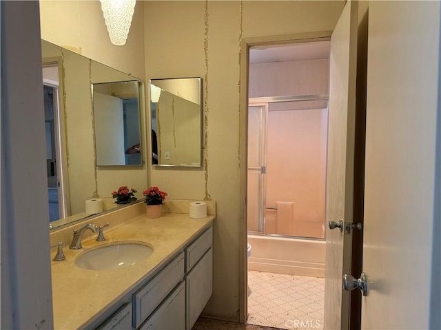 9025 Willis Ave Unit 141, Panorama City, CA 91402 - full bath featuring vanity, tile patterned floors, and shower / bath combination with glass door