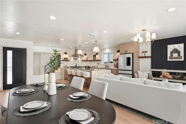 17174 Santa Madrina St, Fountain Valley, CA 92708 - dining area with a chandelier, recessed lighting, and light wood-type flooring