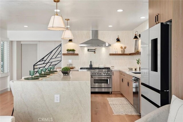 17174 Santa Madrina St, Fountain Valley, CA 92708 - kitchen featuring appliances with stainless steel finishes, wall chimney exhaust hood, open shelves, light wood-style floors, and recessed lighting
