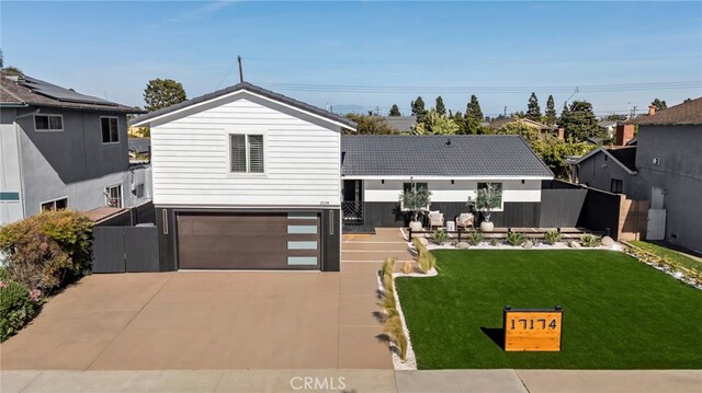 17174 Santa Madrina St, Fountain Valley, CA 92708 - view of front of home with driveway and a garage