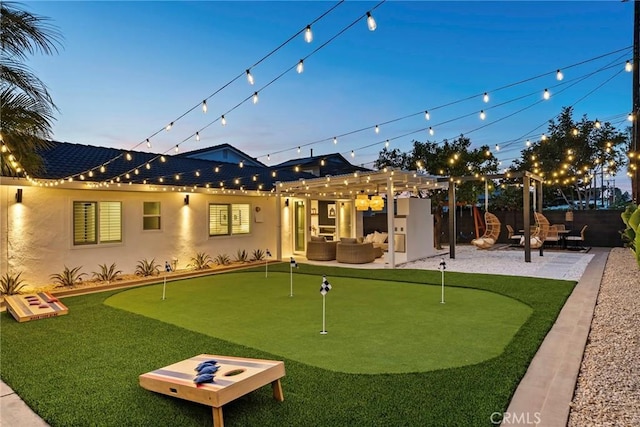 17174 Santa Madrina St, Fountain Valley, CA 92708 - back of property featuring a putting green, a pergola, and stucco siding