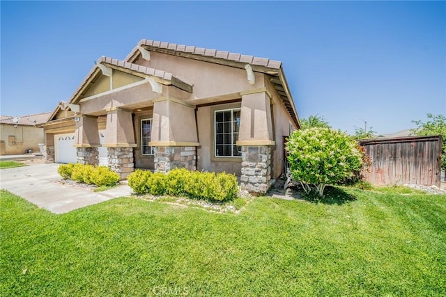 13932 Pinellia St, Hesperia, CA 92344 - view of front facade featuring stone siding, a garage, a front lawn, stucco siding, and concrete driveway