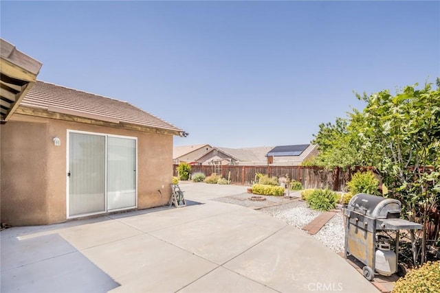 13932 Pinellia St, Hesperia, CA 92344 - fenced backyard featuring a patio and a grill