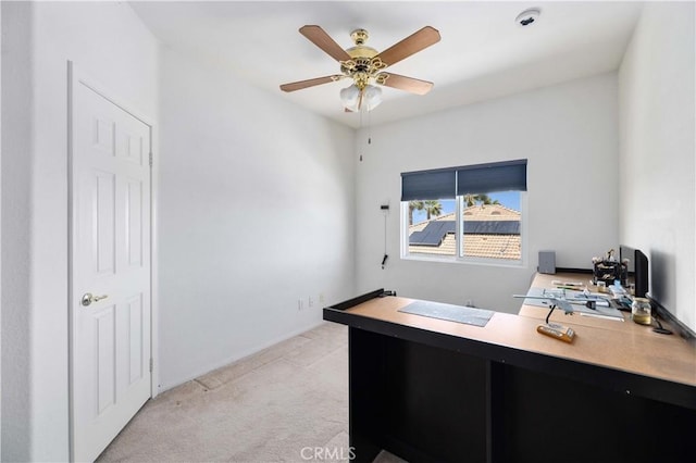 office area with light colored carpet and a ceiling fan