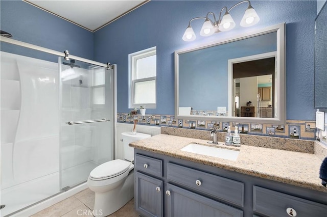 bathroom featuring a stall shower, tile patterned flooring, toilet, and vanity