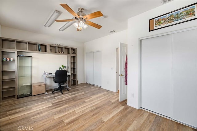office area featuring a ceiling fan and light wood finished floors