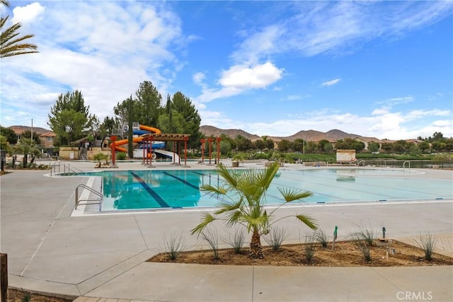 29604 Starring Ln, Menifee, CA 92584 - community pool with a mountain view, a water slide, and a patio