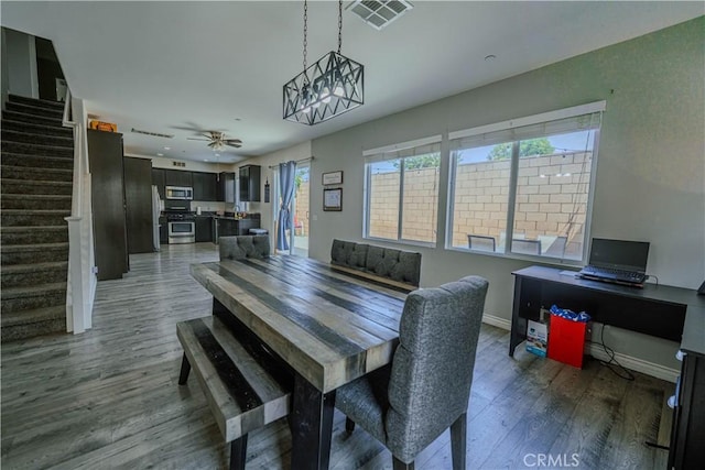 16540 Cadence Ln, Fontana, CA 92336 - dining room featuring stairs, wood finished floors, baseboards, ceiling fan, and an office area