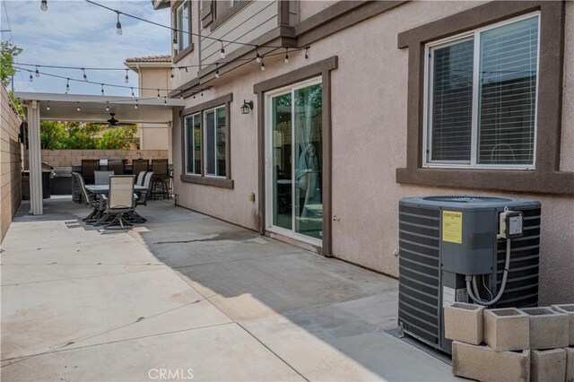 16540 Cadence Ln, Fontana, CA 92336 - view of patio with cooling unit, a ceiling fan, and outdoor dining area