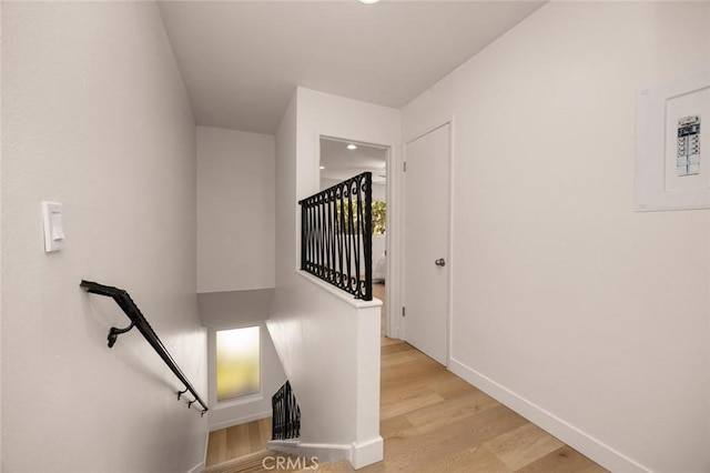 1881 Mitchell Ave Unit 114, Tustin, CA 92780 - stairway with baseboards, wood finished floors, and recessed lighting