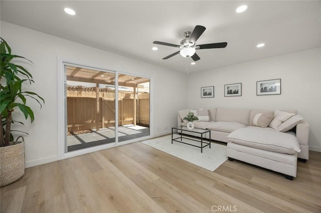 1881 Mitchell Ave Unit 114, Tustin, CA 92780 - living area featuring wood finished floors, a ceiling fan, baseboards, and recessed lighting