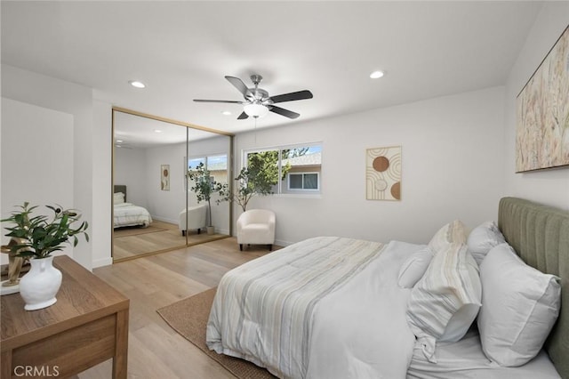 1881 Mitchell Ave Unit 114, Tustin, CA 92780 - bedroom featuring recessed lighting, light wood-style floors, ceiling fan, a closet, and baseboards