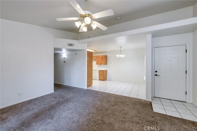1542 E Alluvial Ave Unit 258, Fresno, CA 93720 - unfurnished living room with light colored carpet, light tile patterned flooring, ceiling fan, and a chandelier