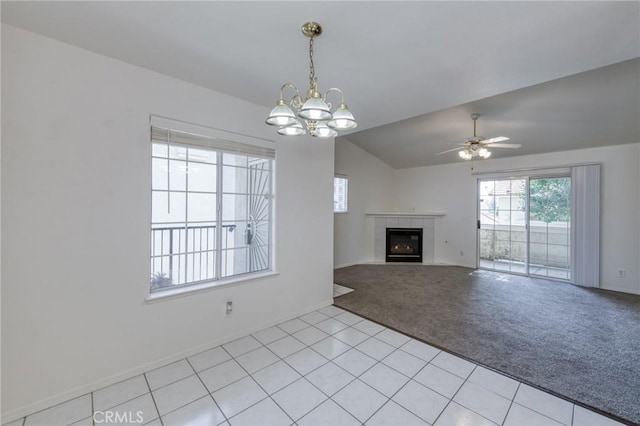 1542 E Alluvial Ave Unit 258, Fresno, CA 93720 - unfurnished living room with light carpet, a chandelier, a tile fireplace, ceiling fan, and lofted ceiling