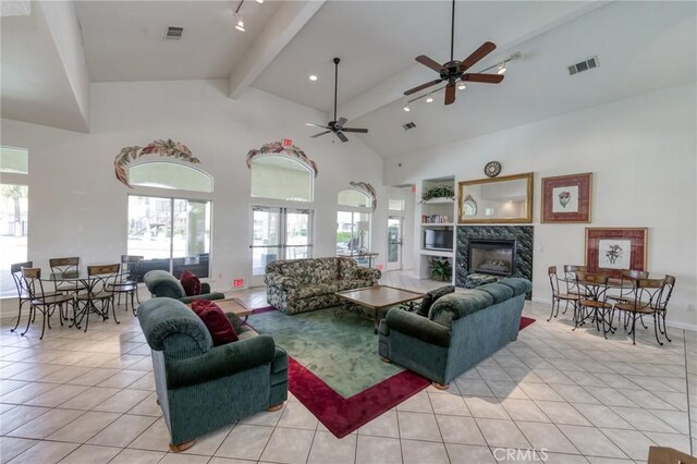 1542 E Alluvial Ave Unit 258, Fresno, CA 93720 - living room with beam ceiling, light tile patterned floors, a fireplace, ceiling fan, and rail lighting