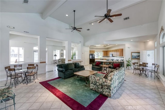 1542 E Alluvial Ave Unit 258, Fresno, CA 93720 - living area featuring light tile patterned floors, beam ceiling, a ceiling fan, high vaulted ceiling, and healthy amount of natural light