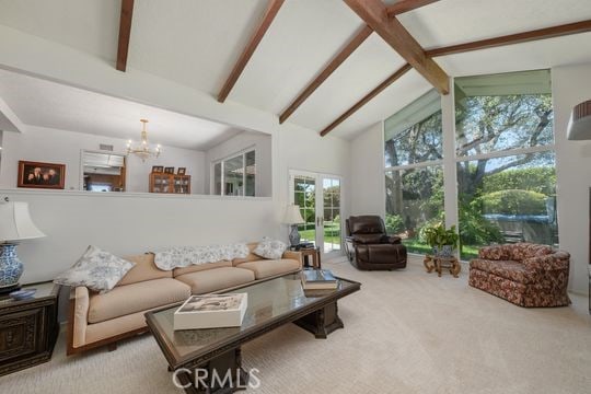 6741 Monero Dr, Rancho Palos Verdes, CA 90275 - living area with beamed ceiling, a chandelier, carpet floors, and high vaulted ceiling