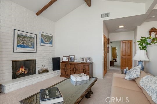 6741 Monero Dr, Rancho Palos Verdes, CA 90275 - living area with carpet flooring and a fireplace