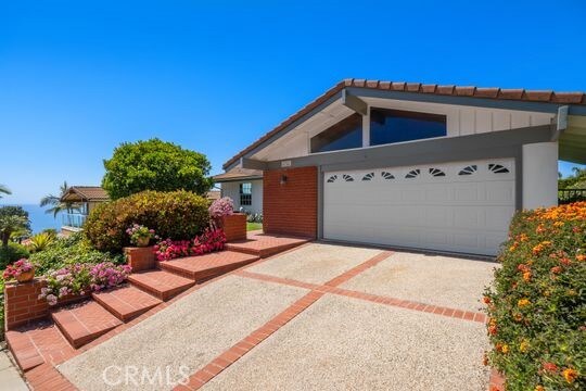 6741 Monero Dr, Rancho Palos Verdes, CA 90275 - view of front of property featuring driveway, a garage, and a tile roof