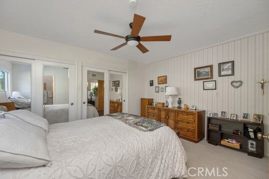6741 Monero Dr, Rancho Palos Verdes, CA 90275 - carpeted bedroom with a closet and a ceiling fan