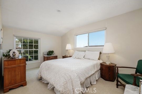 6741 Monero Dr, Rancho Palos Verdes, CA 90275 - bedroom with light carpet, multiple windows, and lofted ceiling