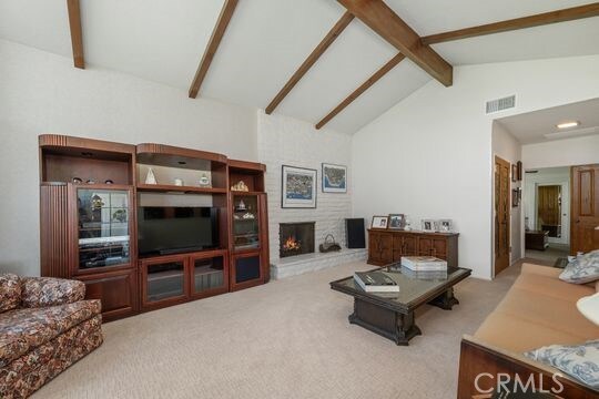 6741 Monero Dr, Rancho Palos Verdes, CA 90275 - living room with carpet and a large fireplace