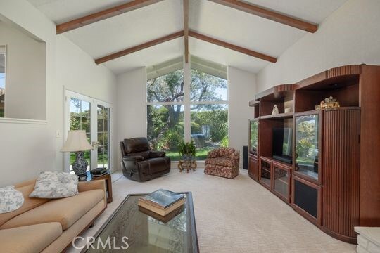 6741 Monero Dr, Rancho Palos Verdes, CA 90275 - living area featuring beam ceiling, carpet floors, and high vaulted ceiling