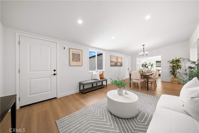 12391 Beck Ave, Garden Grove, CA 92840 - living room with a chandelier, light wood-style flooring, recessed lighting, baseboards, and plenty of natural light
