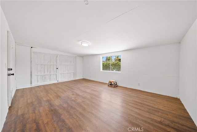 12391 Beck Ave, Garden Grove, CA 92840 - unfurnished room featuring wood finished floors and vaulted ceiling