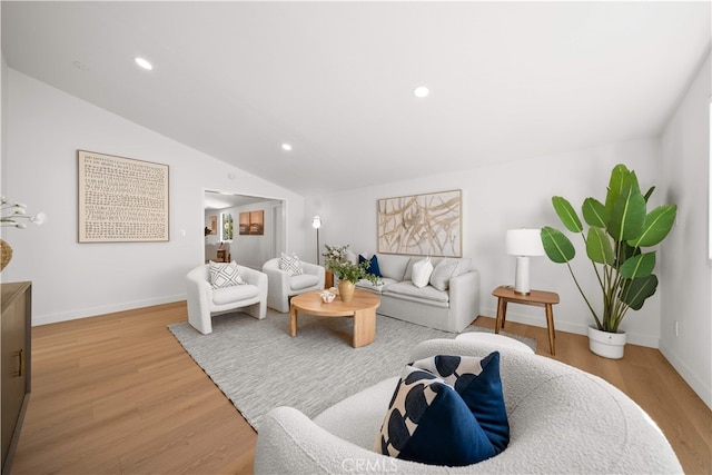 12391 Beck Ave, Garden Grove, CA 92840 - living room with light wood-style flooring, baseboards, lofted ceiling, and recessed lighting