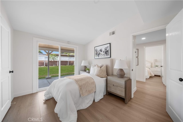 12391 Beck Ave, Garden Grove, CA 92840 - bedroom featuring access to exterior, light wood-type flooring, lofted ceiling, baseboards, and recessed lighting